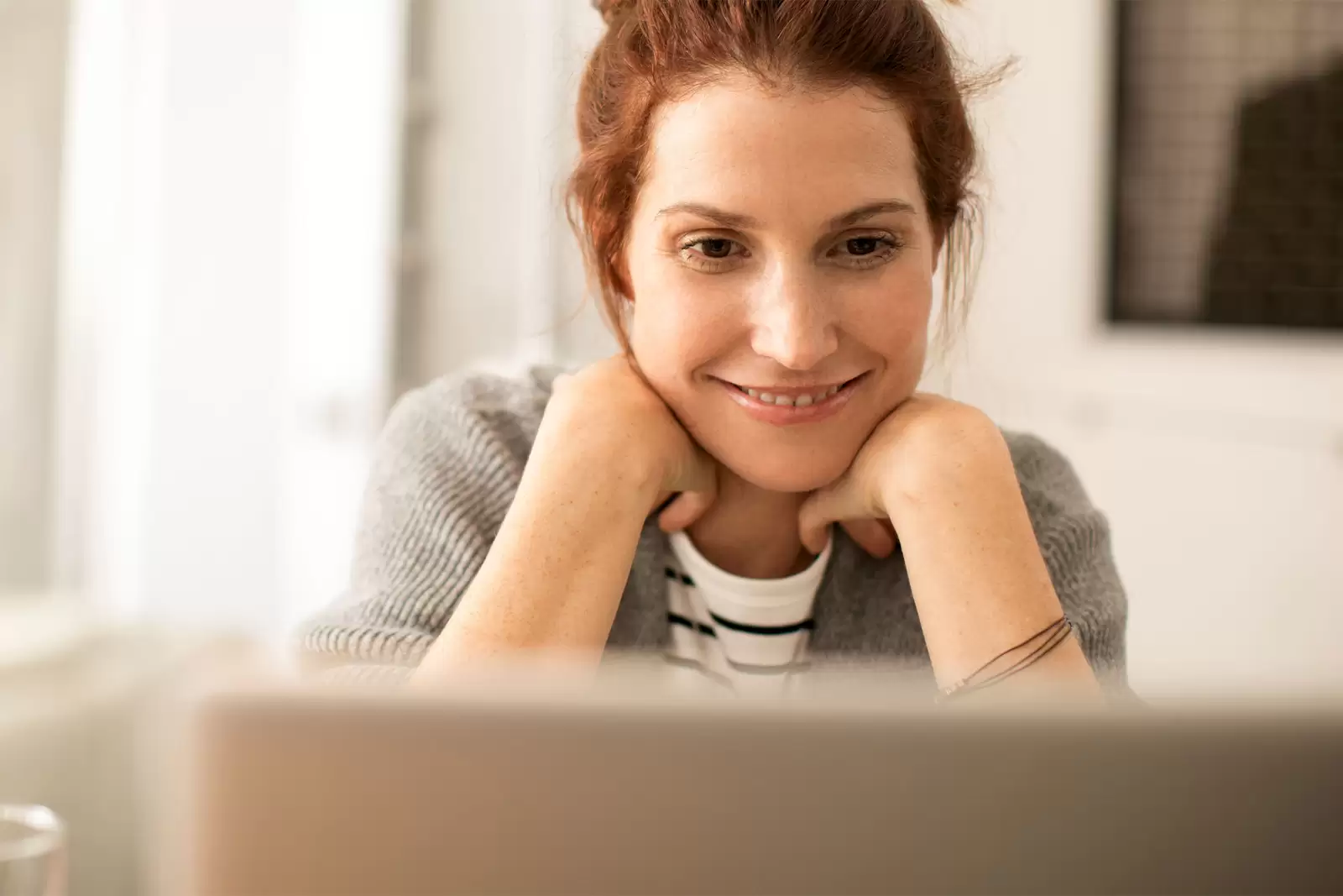 women-behind-laptop-smiling